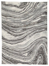 Ashley Furniture Wysdale 5'3" x 7'3" rug with intricate patterns and soft texture, perfect for adding style to living spaces.