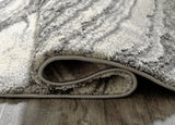 Ashley Furniture Wysdale 5'3" x 7'3" rug with intricate pattern and soft texture, perfect for living room or bedroom decor.