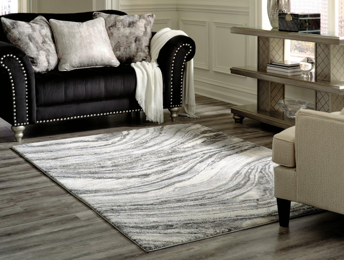 Ashley Wysdale 7'10" x 10'3" rug with intricate pattern in neutral tones, made for stylish indoor living spaces.
