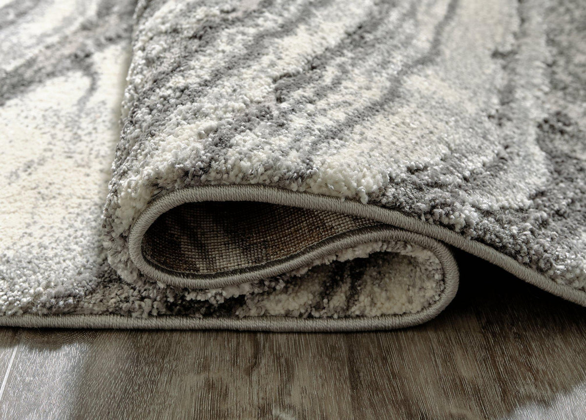 Ashley Wysdale 7'10" x 10'3" rug featuring intricate patterns and neutral tones, perfect for adding style to living spaces.