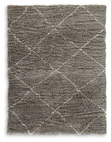 Ashley Furniture Wrenlow Rug with intricate woven pattern in neutral tones, perfect for living room or bedroom decor