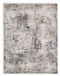 Large Ashley Furniture Elaning rug with intricate patterns, soft texture, and neutral colors perfect for living room or bedroom decor.