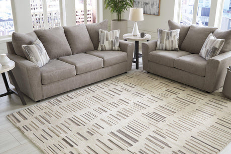 Large Leesdale 8x10 rug by Ashley Furniture featuring a cozy, patterned design suitable for living rooms or bedrooms.
