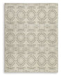 Large Maconville rug by Ashley Furniture with intricate patterns in warm tones, ideal for living room or bedroom decor.