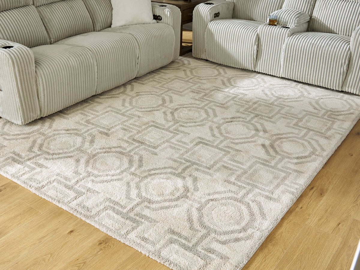 Large Maconville Rug by Ashley Furniture with intricate patterns in neutral tones, perfect for living room or bedroom decor.