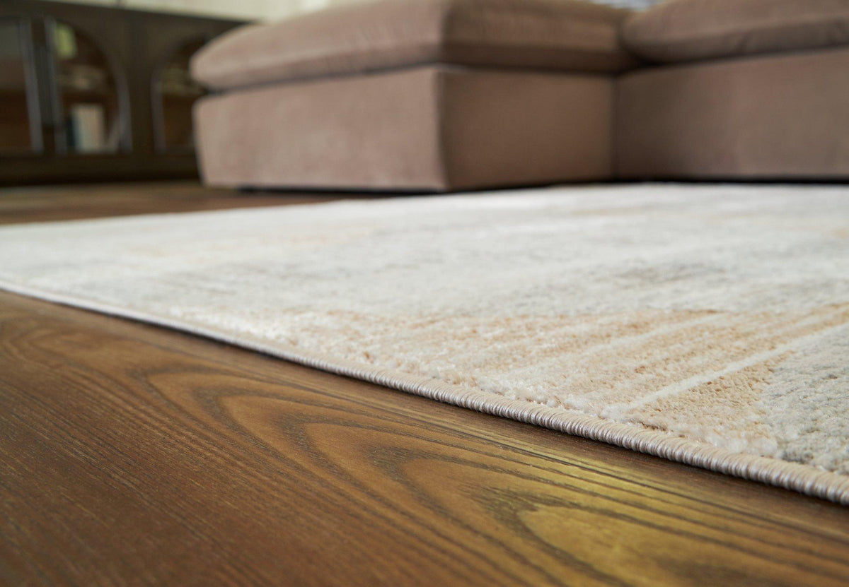 Large Ashley Furniture Truward Rug with intricate pattern and soft texture, perfect for enhancing living room decor.