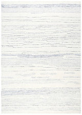Medium Ashley Furniture Genemost Area Rug with intricate patterns in warm tones, suitable for living room or bedroom decor.