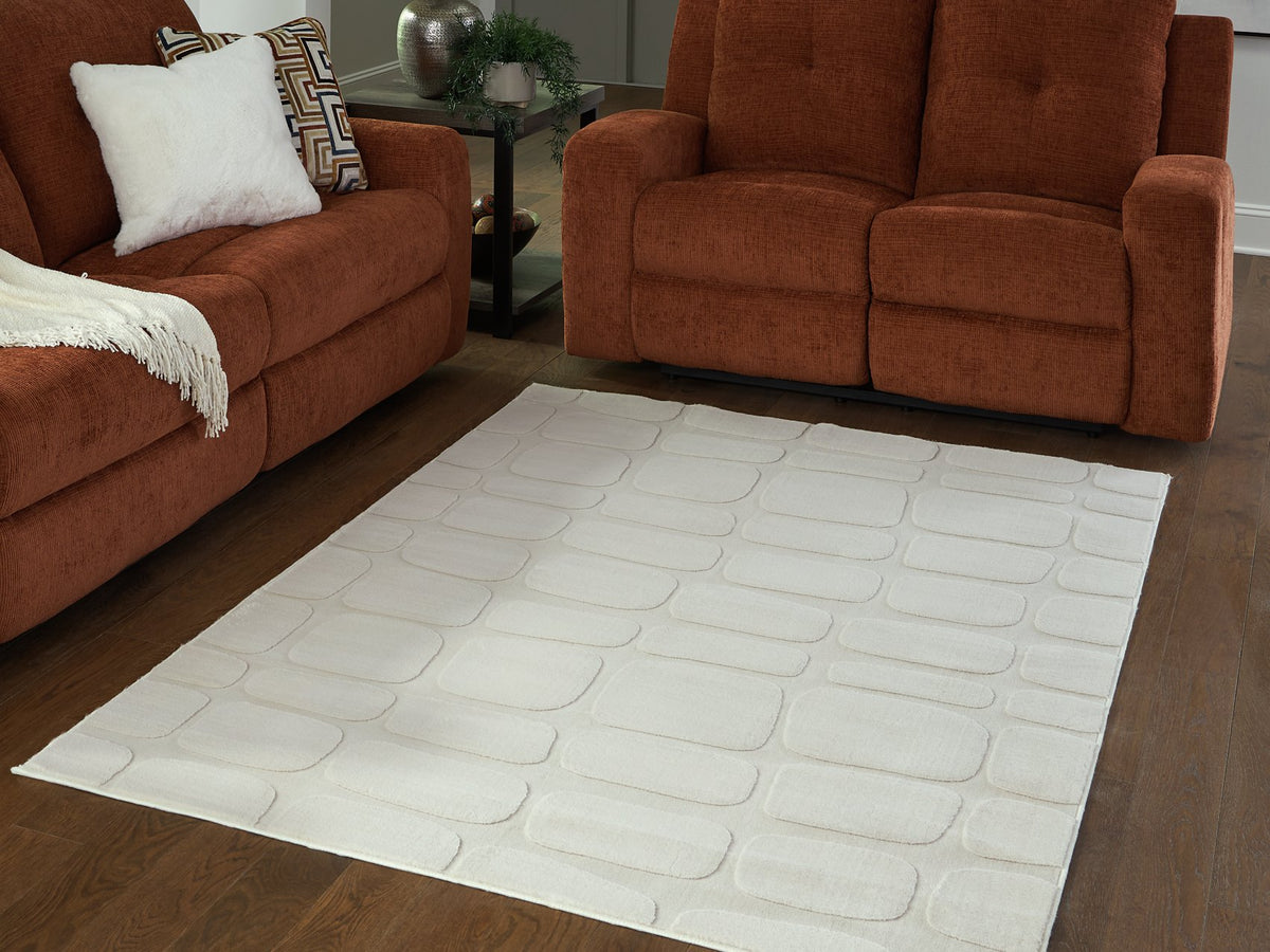 Medium washable area rug by Ashley Furniture with a textured pattern, measuring approximately 4x3 feet.