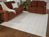 Medium washable area rug from Ashley Furniture, featuring a soft, textured surface in a neutral color, perfect for living rooms or bedrooms.