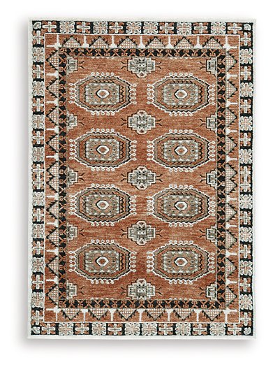 Medium Ashley Furniture Qaabiz Area Rug with intricate patterns, showcasing soft colors and plush texture.