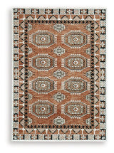 Medium Ashley Furniture Qaabiz Area Rug with intricate patterns, showcasing soft colors and plush texture.