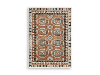Medium Ashley Furniture Qaabiz Area Rug with intricate patterns, shown in a stylish, neutral-toned design.