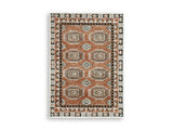 Medium Ashley Furniture Qaabiz Area Rug with intricate patterns, shown in a stylish, neutral-toned design.