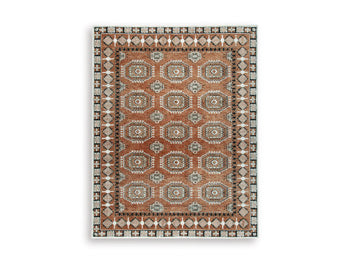 Medium Ashley Furniture Qaabiz Area Rug with intricate pattern in shades of blue and beige, perfect for living room decor.