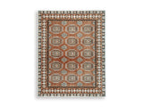 Medium Ashley Furniture Qaabiz Area Rug with intricate pattern in shades of blue and beige, perfect for living room decor.