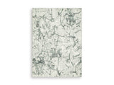 Medium washable area rug by Ashley Furniture featuring a stylish design, perfect for adding comfort to living spaces.