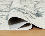 Medium Ashley Furniture Tobinbury washable area rug with detailed pattern, showcasing soft, durable fabric in natural tones.