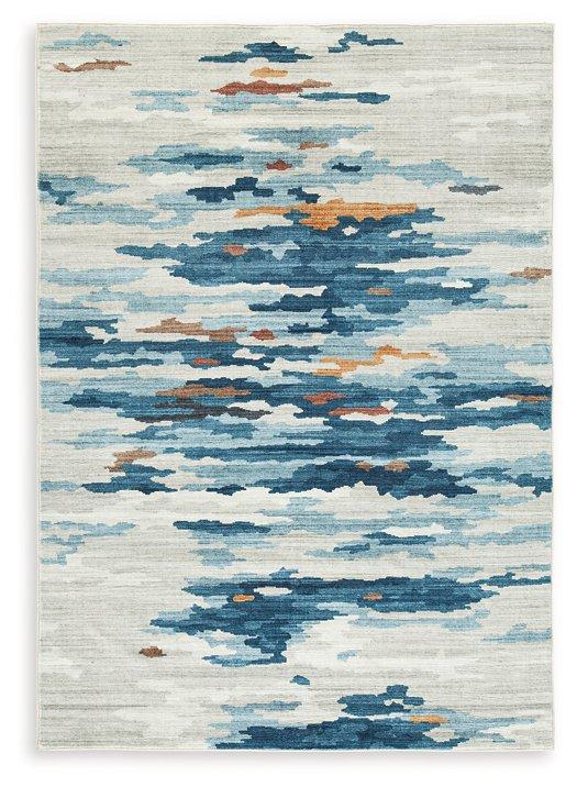 Medium washable rug by Ashley Furniture with a soft, patterned design, perfect for living rooms or bedrooms.