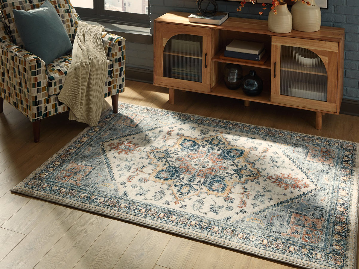 Medium Wallney area rug by Ashley Furniture, featuring a stylish pattern, shown cropped in a 4x3 image.