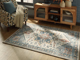 Medium Wallney area rug by Ashley Furniture, featuring a stylish pattern, shown cropped in a 4x3 image.