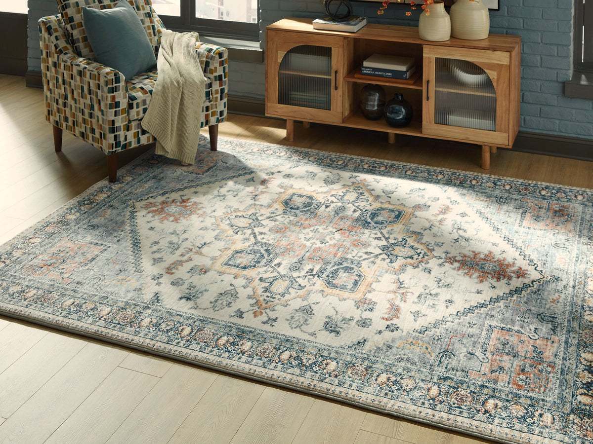 Medium Ashley Furniture Wallney area rug with a textured pattern, showcasing its soft, woven design on a neutral background.
