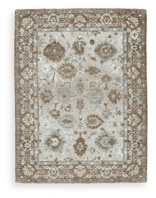 Ashley Furniture Ainswick Memory Foam Rug with plush, textured surface in neutral tones, ideal for cozy living spaces.