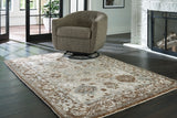 Ainswick memory foam rug by Ashley Furniture with plush, textured surface and neutral color, ideal for cozy living space decor.