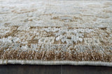 Close-up of Ashley Furniture Ainswick memory foam rug with plush texture and detailed edging.