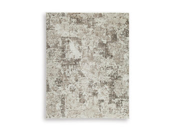 Ashley Furniture Barricland Rug with intricate patterns in neutral tones, showcasing a plush and stylish rug design.