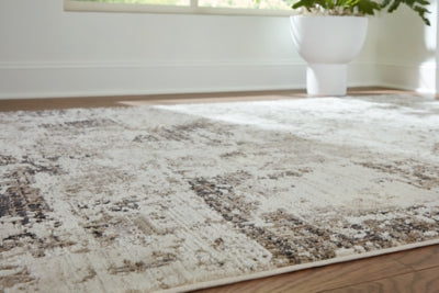 Close-up of Ashley Furniture Barricland Rug showcasing detailed woven pattern and rich, neutral colors for home décor.