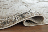 Close-up of Ashley Furniture Barricland Rug, showcasing its detailed pattern and textured surface in natural colors.