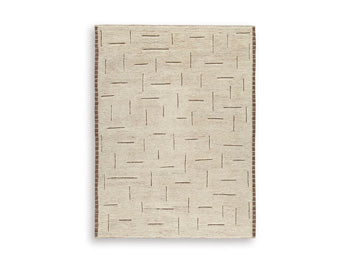 Ashley Furniture Clayman Rug with a textured, neutral-toned design showcasing soft woven fabric and stylish pattern.