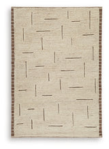 Ashley Furniture Clayman Rug featuring a textured, woven design in earthy tones, perfect for adding warmth to living spaces.