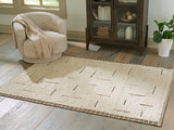 Ashley Furniture Clayman Rug with a textured 4x3-foot design, showcasing a soft, woven surface in neutral tones.