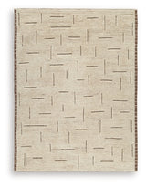 Ashley Furniture Clayman Rug featuring a textured, neutral-toned design suitable for living room or bedroom decor.
