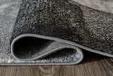 Medium Ashley Furniture Brycebourne 5'3" x 7'7" rug with intricate pattern and soft texture, ideal for enhancing living room decor.