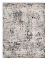 Medium Ashley Furniture Elaning rug with intricate pattern in neutral tones, showcasing soft woven texture and decorative border.