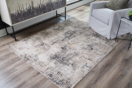 Medium Ashley Furniture Elaning rug with intricate pattern, showcasing soft, plush texture and neutral color tones.