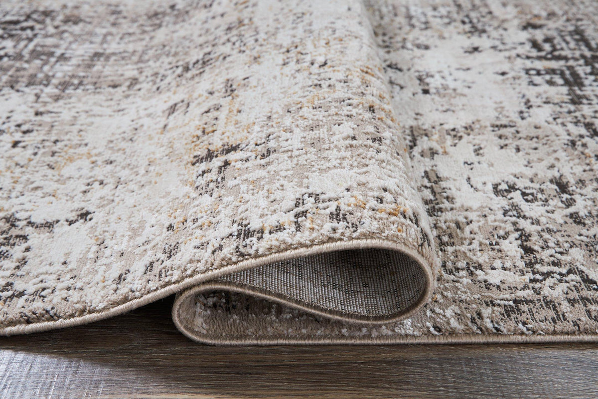 Medium Ashley Furniture Elaning rug with intricate patterns and soft textures, perfect for adding elegance to living spaces.