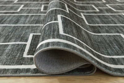 Ashley Furniture Elderland washable 5x7 medium area rug with detailed pattern, suitable for living rooms or bedrooms.