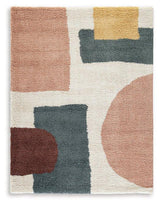 Medium Flynnwick 5x7 rug by Ashley Furniture featuring a detailed pattern in neutral tones on a soft fabric background.