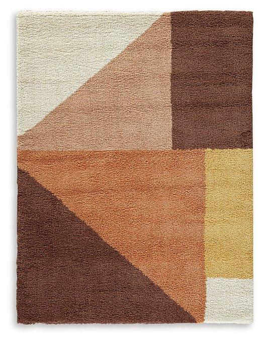 Medium Ashley Furniture Gailmore 5x7 rug with a detailed pattern, showcasing soft colors and a plush texture on a neutral floor.