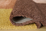 Medium Ashley Furniture Gailmore 5' x 7' rug featuring a detailed pattern in neutral tones on a soft fabric background.