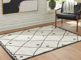 Ashley Furniture Fenriston Rug with intricate patterns in neutral tones, perfect for enhancing living room or bedroom decor.
