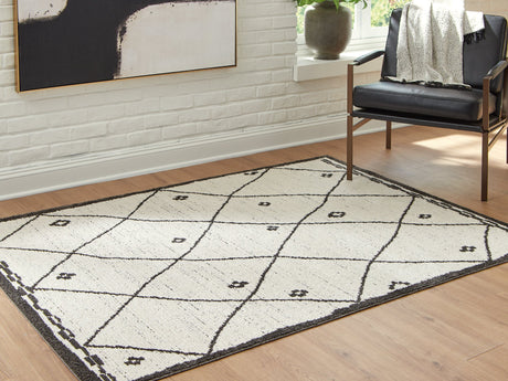 Ashley Furniture Fenriston Rug with intricate patterns in neutral tones, perfect for enhancing living room or bedroom decor.