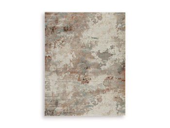 Ashley Furniture Jadenburg Rug featuring a detailed woven pattern in neutral tones, suitable for living room or bedroom decor.