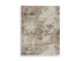 Ashley Furniture Jadenburg Rug featuring a detailed woven pattern in neutral tones, suitable for living room or bedroom decor.
