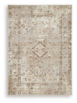 Ashley Furniture Livdon washable rug with a soft, patterned design, ideal for living room or bedroom decor.
