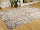 Ashley Furniture Livdon washable rug with a textured, patterned design in neutral tones, perfect for living room or bedroom decor.