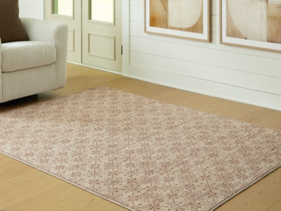 Ashley Furniture Lyamford rug in neutral tones, featuring a woven design, shown in a close-up image.